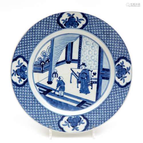 A large blue and white soft paste plate