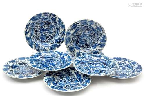 Eight blue and white Monkey and Phoenix plates