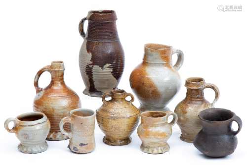 A collection of nine German stoneware jugs and mugs