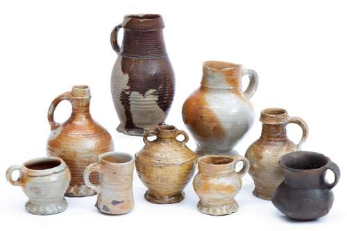 A collection of nine German stoneware jugs and mugs