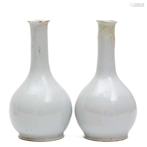 A pair of white Delft bottle vases