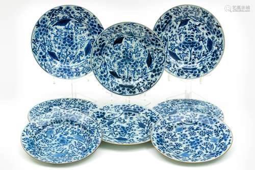 Eight blue and white peony or grapes plates