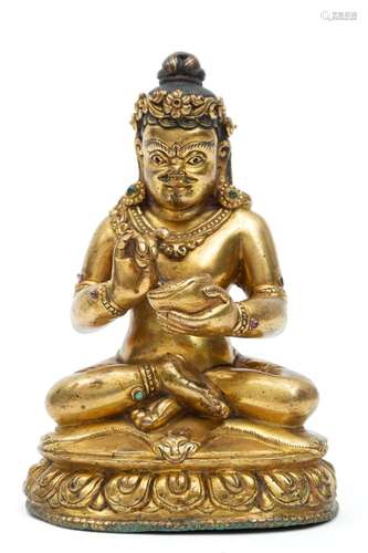 A gilt copper figure of a Mahasiddha