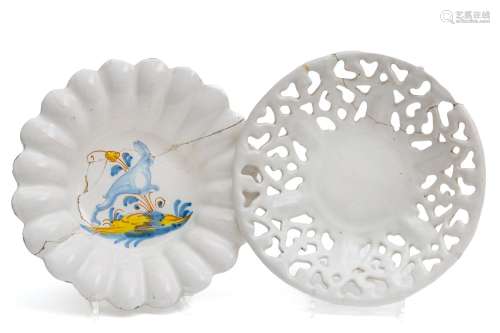 A white faience pierced bowl and a French majolica lobed dis...