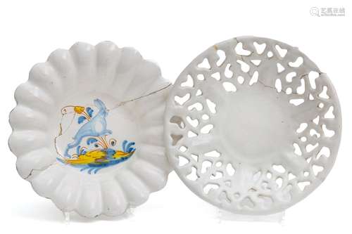 A white faience pierced bowl and a French majolica lobed dis...