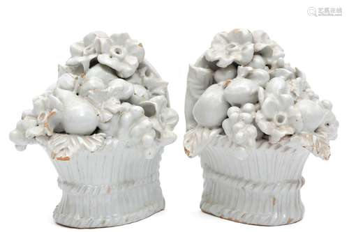 A pair of white faience flower basket bookends