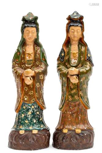 A large pair of white faience cold painted Guanyin figures