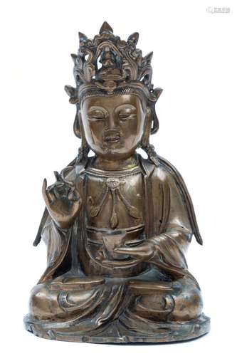 A bronze seated Guanyin figure