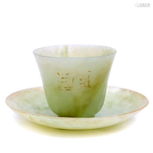 A carved jade cup and saucer