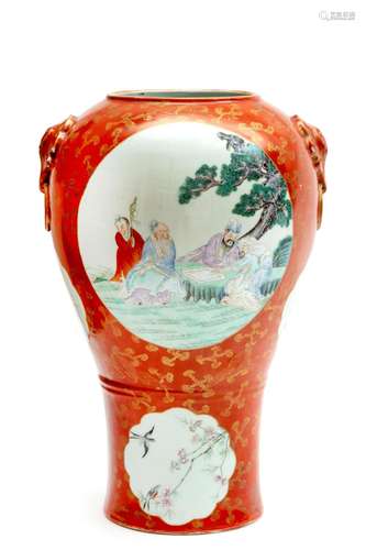 A coral ground gilt decorated famille rose vase