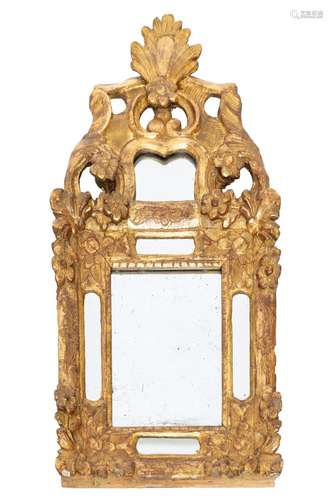 A Louis XV provincial carved giltwood mirror