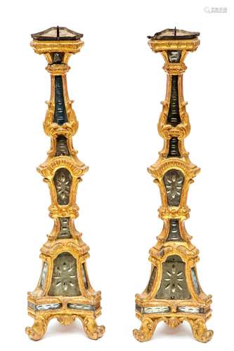 A pair of Italian carved giltwood and mirrored glass pricket...