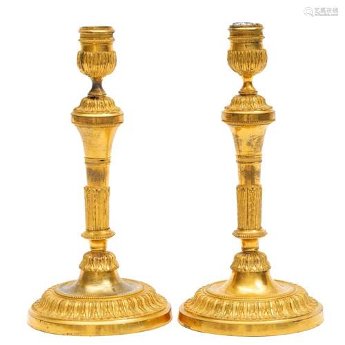 A pair of Empire ormolu candlesticks