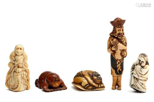 Four ivory carved Japanese netsuke and one Chinese toggle