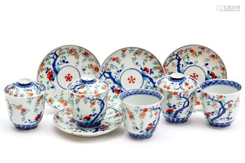 A part set of Japanese kakiemon covered cups and saucers