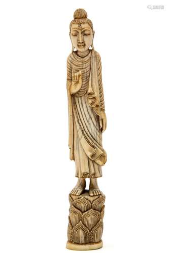 A Burmese ivory carved figure of a walking Buddha