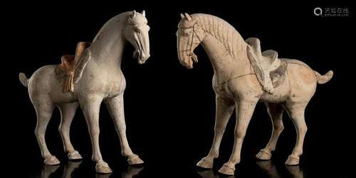 A PAIR OF PAINTED CERAMIC HORSES China, Tang dynasty