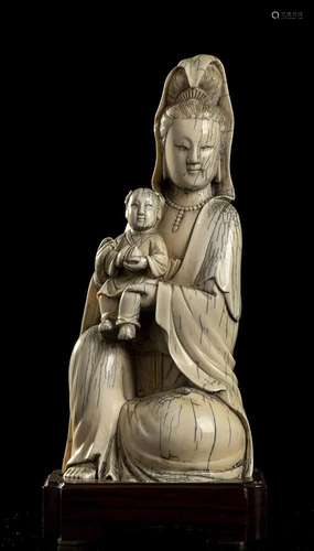 AN IVORY GUANYIN WITH CHILD China, Qing dynasty, 19th