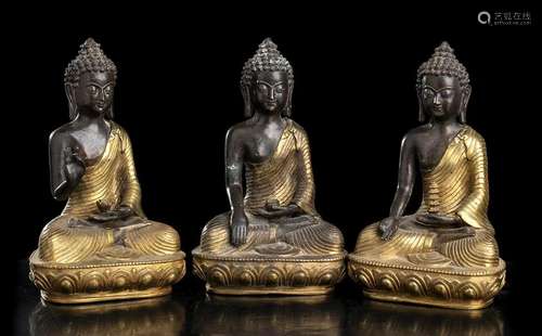 THREE PARTIALLY GILT METAL BUDDHA China, 20th century