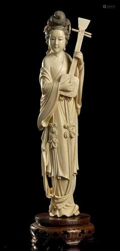 AN IVORY FEMALE FIGURE WITH AN INSTRUMENT China, early