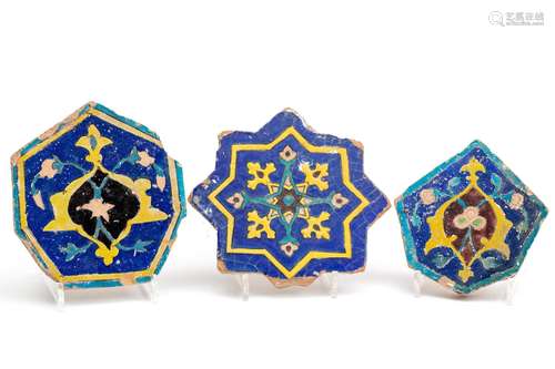 Three Safavid cuerda seca star shaped tiles