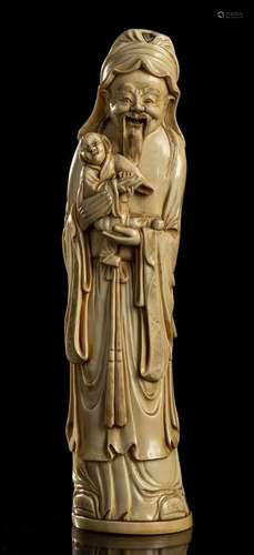 AN IVORY DEITY WITH CHILD China, early 20th century