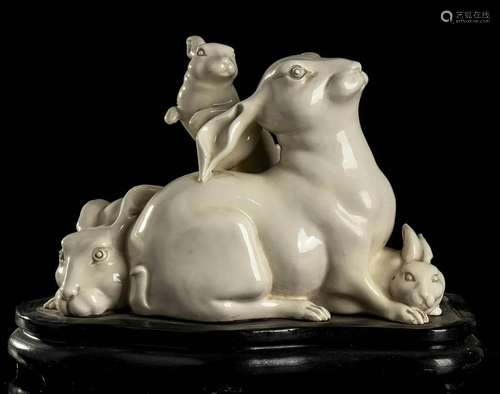 A GLAZED PORCELAIN GROUP WITH THREE RABBITS probably