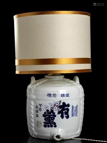 A PAIR OF PORCELAIN SAKE BARRELS MOUNTED AS LAMPS