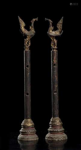 TWO PARTIALLY GILT WOOD SMALL COLUMNS WITH BIRD FINIAL