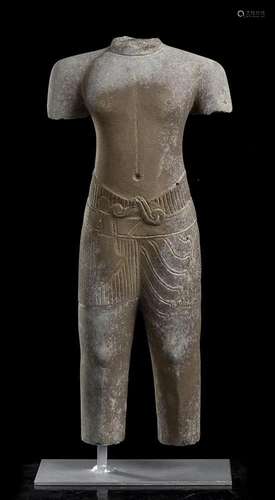 A STONE SCULPTURE OF A MALE FIGURE Cambodia, Khmer