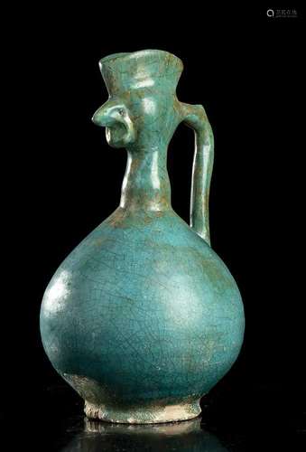 A TURQUOISE GLAZED CERAMIC 'COCK'S HEAD' EWER...