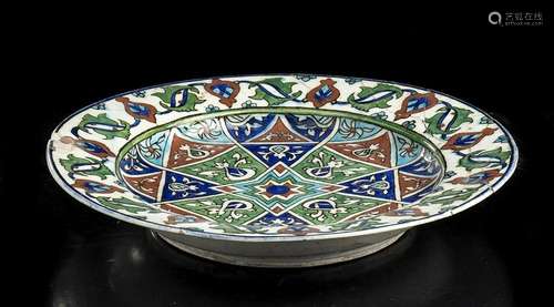 A GLAZED AND PAINTED 'IZNIK' CERAMIC DISH Turkey, ...