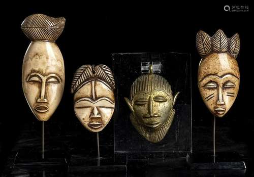 THREE IVORY IKHOKHO MINIATURE MASKS AND A SMALL BRONZE