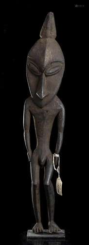 A WOOD ANTHROPOMORPHIC SCULPTURE Papua New Guinea,