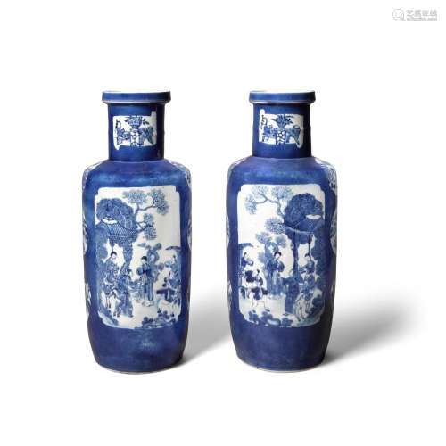 A pair of blue and white powder-blue-ground rouleau vases