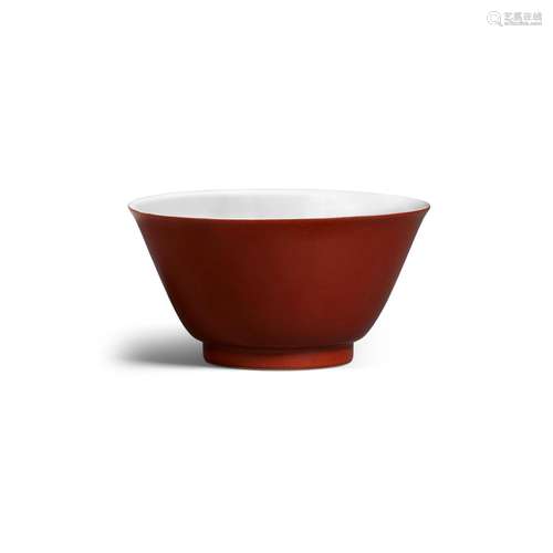 A small coral-red-backed bowl