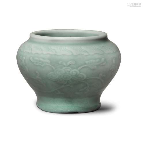 A small celadon-glazed porcelain baluster jar