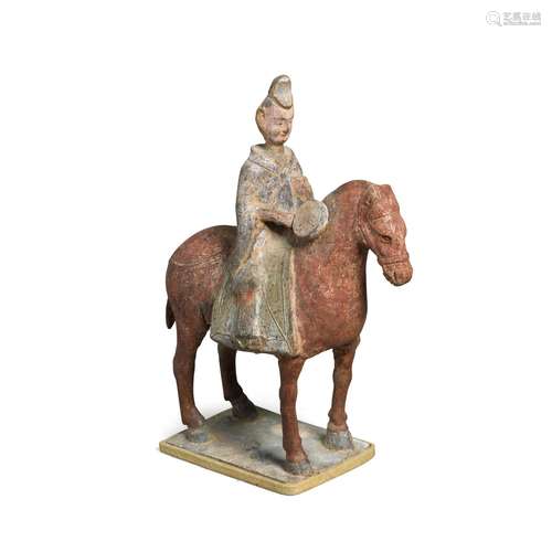 A Painted Pottery Figure of Horse and Rider