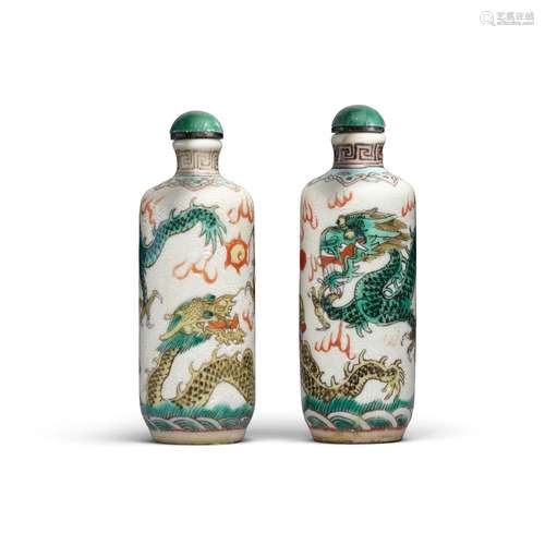 A pair of polychrome-enameled 'dragon' snuff bottles