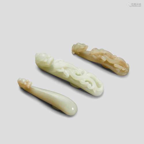 Three jade 'dragon' belt hooks