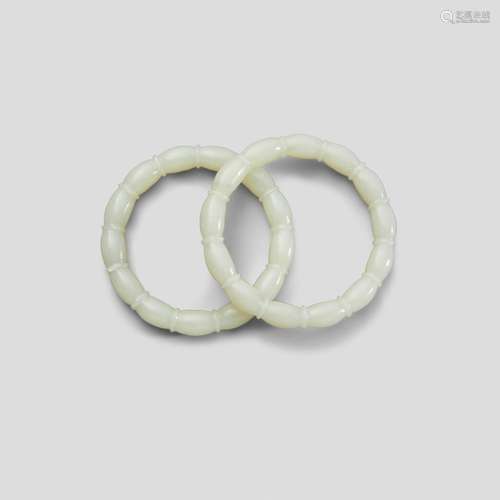 A pair of white jade bangles