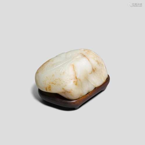 A white and russet jade pebble