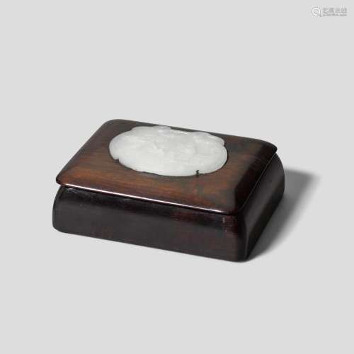A WHITE JADE PLAQUE MOUNTED IN A HARDWOOD BOX AND COVER