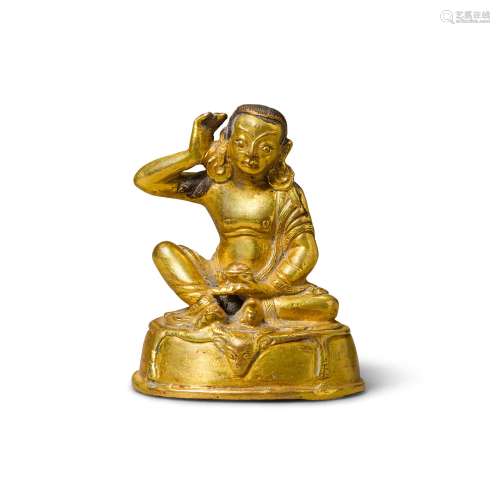 A small gilt bronze Buddhist figure of Milarepa