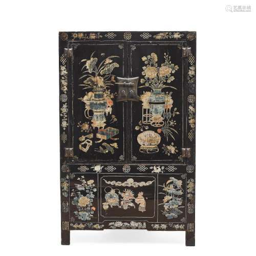 An elaborate black-ground polychrome-lacquered cabinet