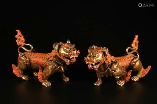 A Pair of Gilt Copper Ornaments