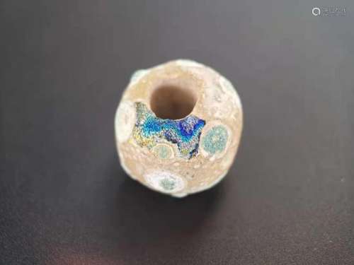 A SPRING AND AUTUMN PERIOD GLASS BEAD