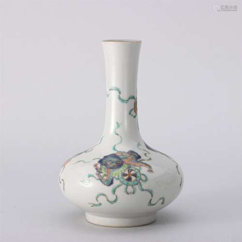 A Famille Rose Lion and Silk Ball Porcelain Vase