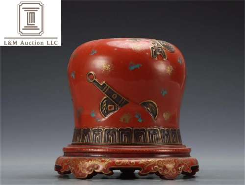 A Chinese Red Glazed Porcelain Jar with Coin