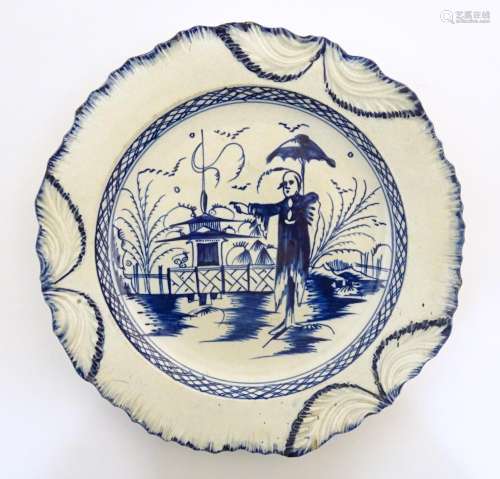 A blue and white pearlware plate decorated in the …